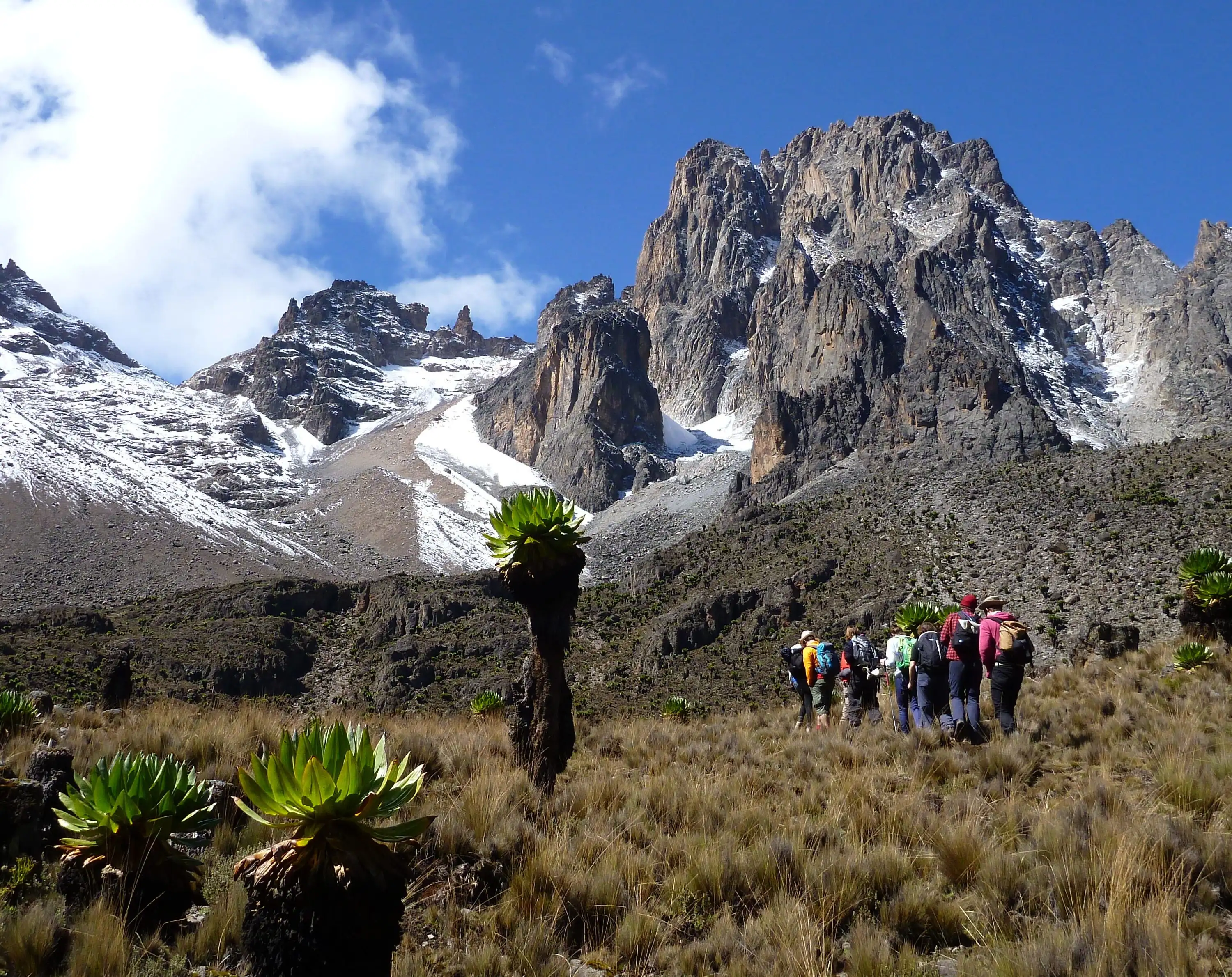 Hikers above the clouds near Point Lenana on Mount Kenya
