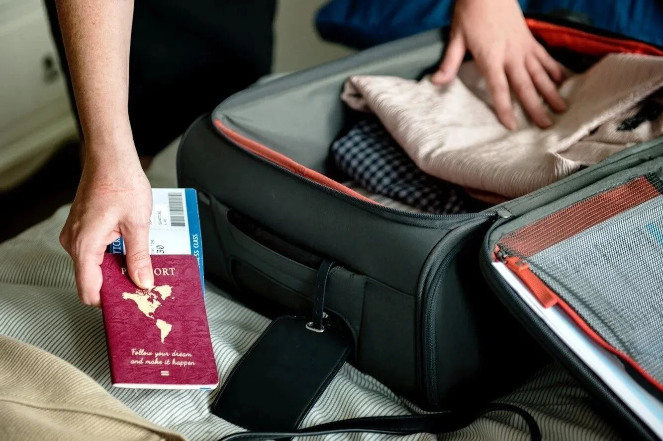 UK traveller preparing for a Kenya safari with important travel health and vaccination documents