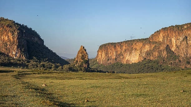 Dramatic volcanic rock formation of Fischer's Tower along the main dirt cycling trail in Hell's Gate National Park
