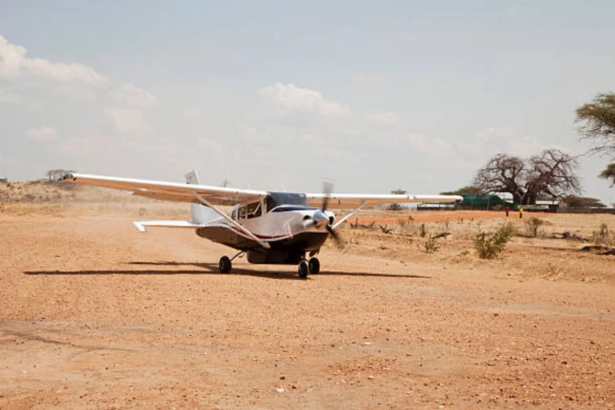 Bush plane parked at a safari airstrip in Kenya for internal fly-in game drive transfers